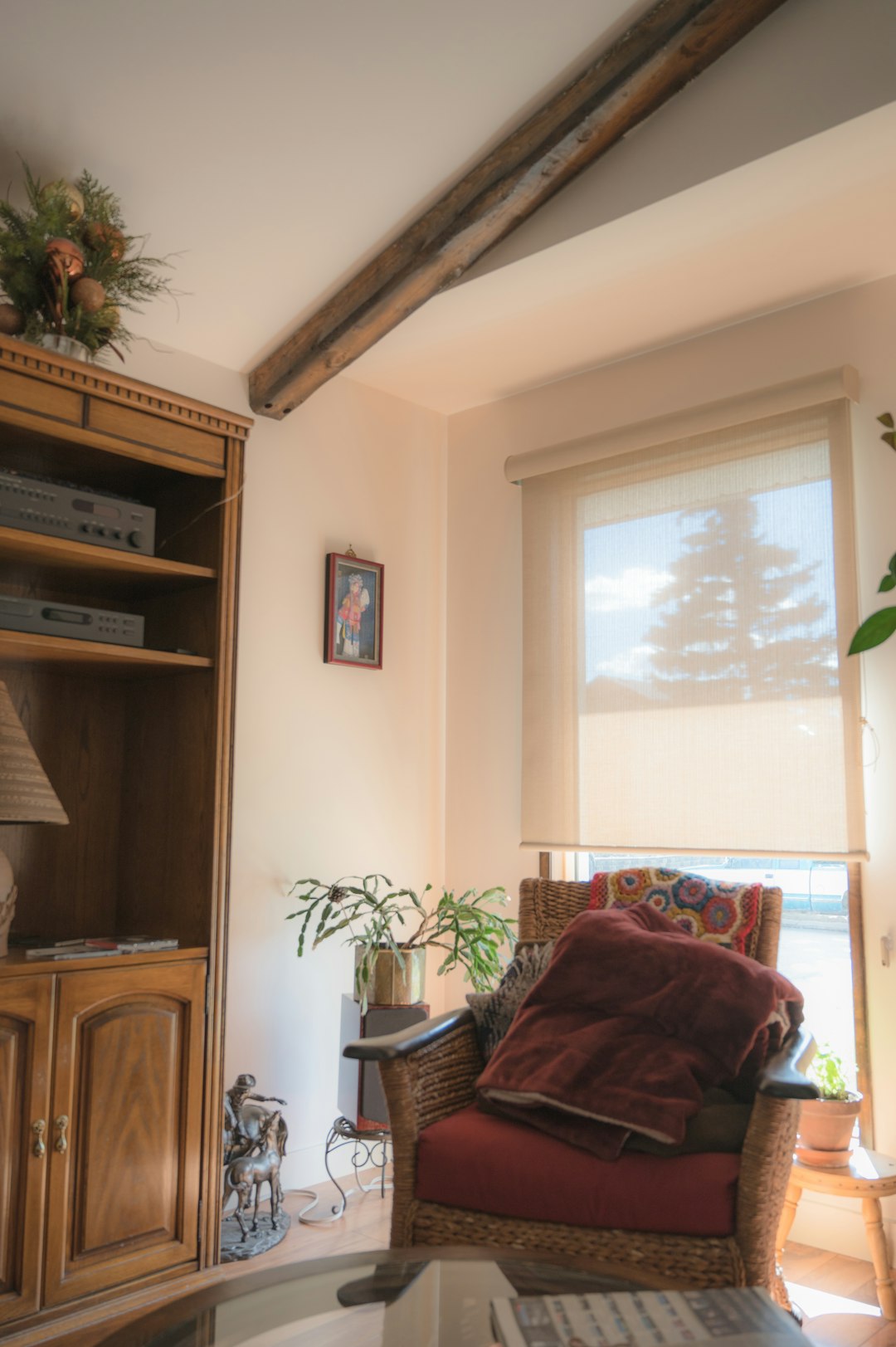 brown wooden cabinet near window