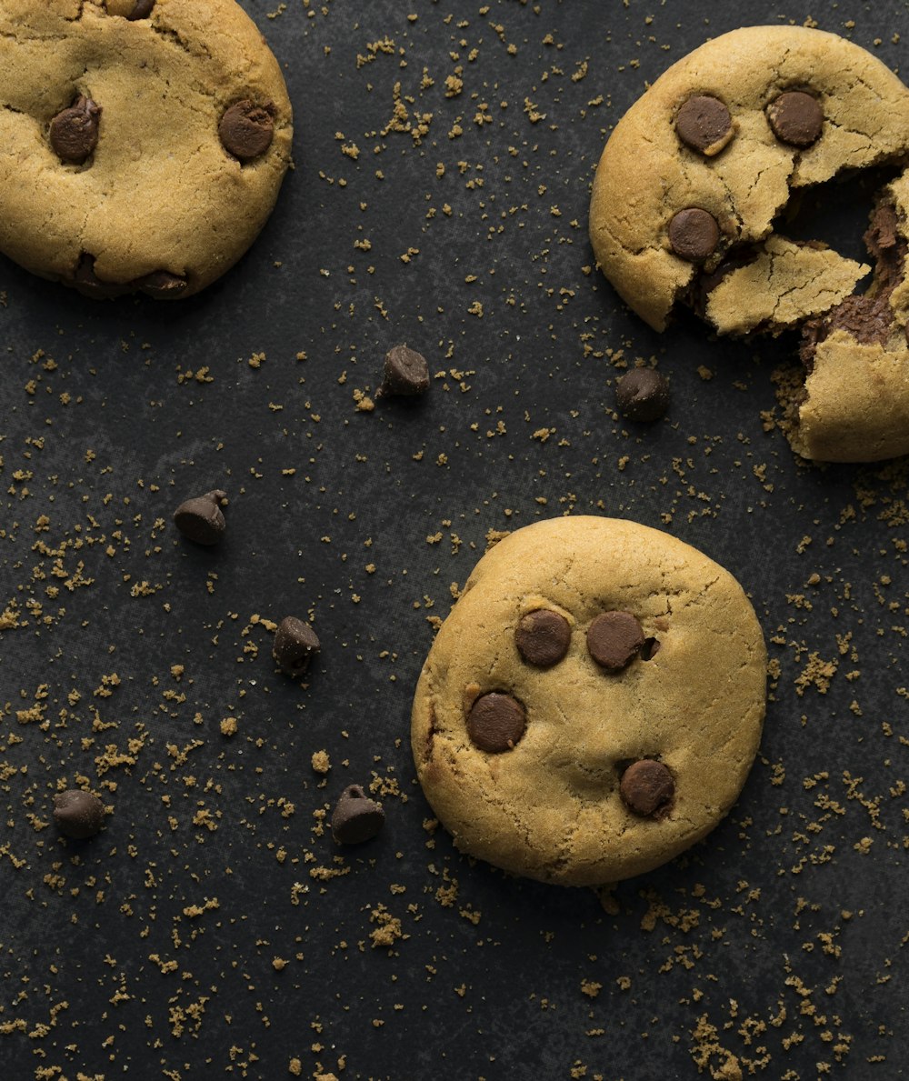 brown round cookie on black sand