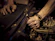 High-resolution photo of automotive technicians working hands-on with hybrid vehicle diagnostic tools.