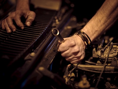 grayscale photo of person playing piano