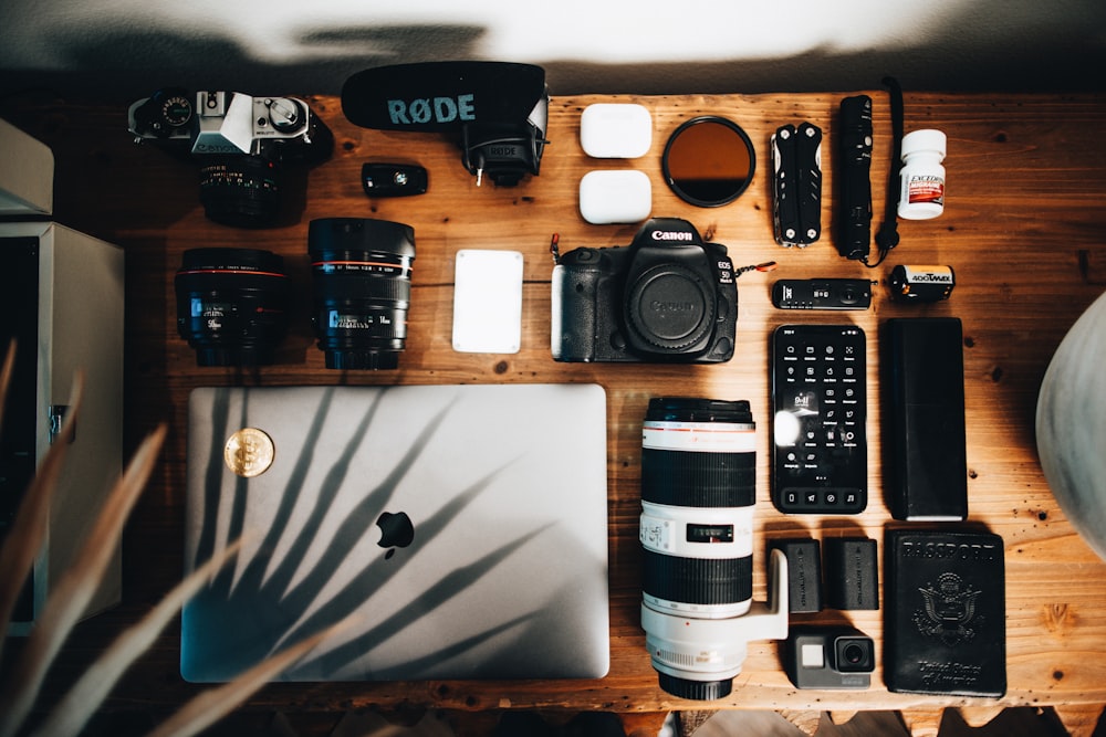 black dslr camera on brown wooden table