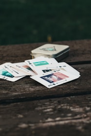white and black cards on brown wooden table
