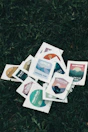 white red and green cards on green grass
