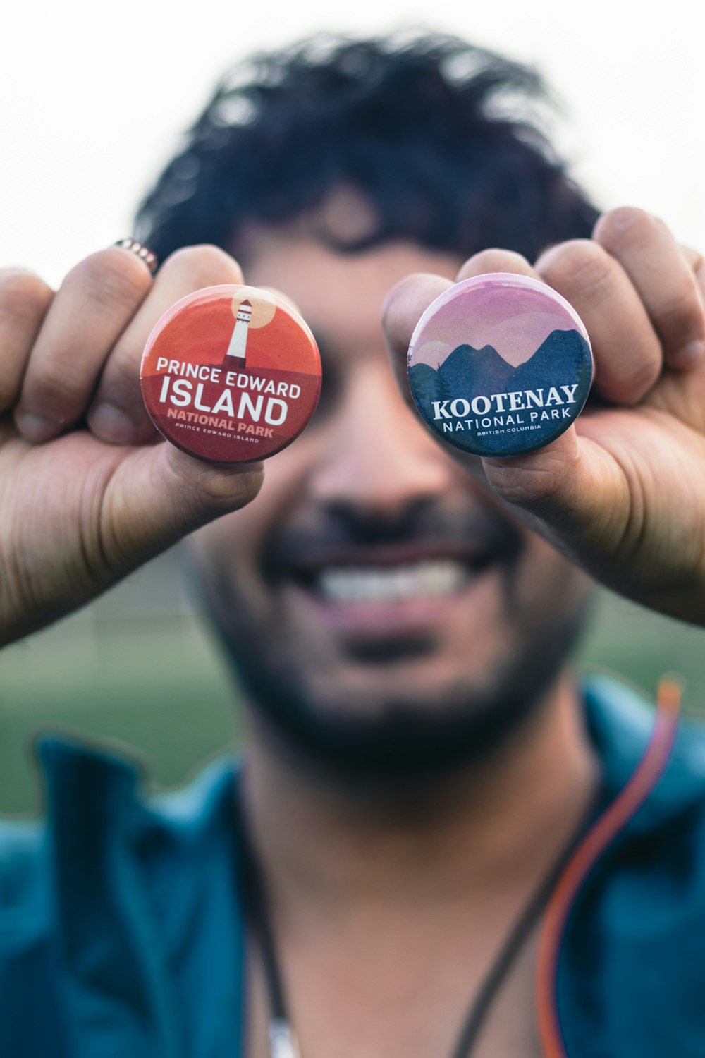 person holding red and blue round ornament