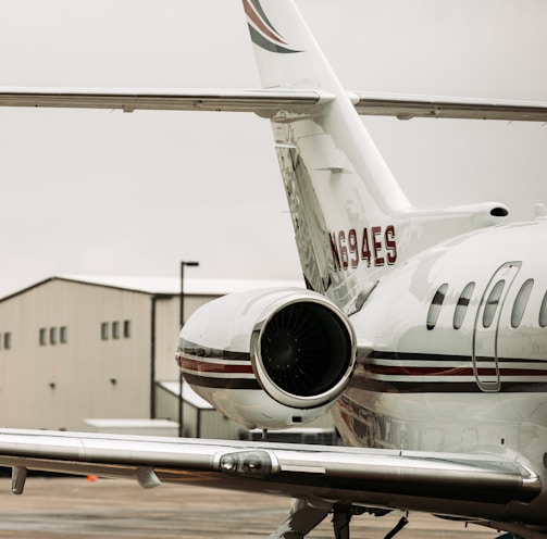 white and red passenger plane