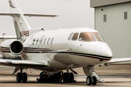 white and blue passenger plane