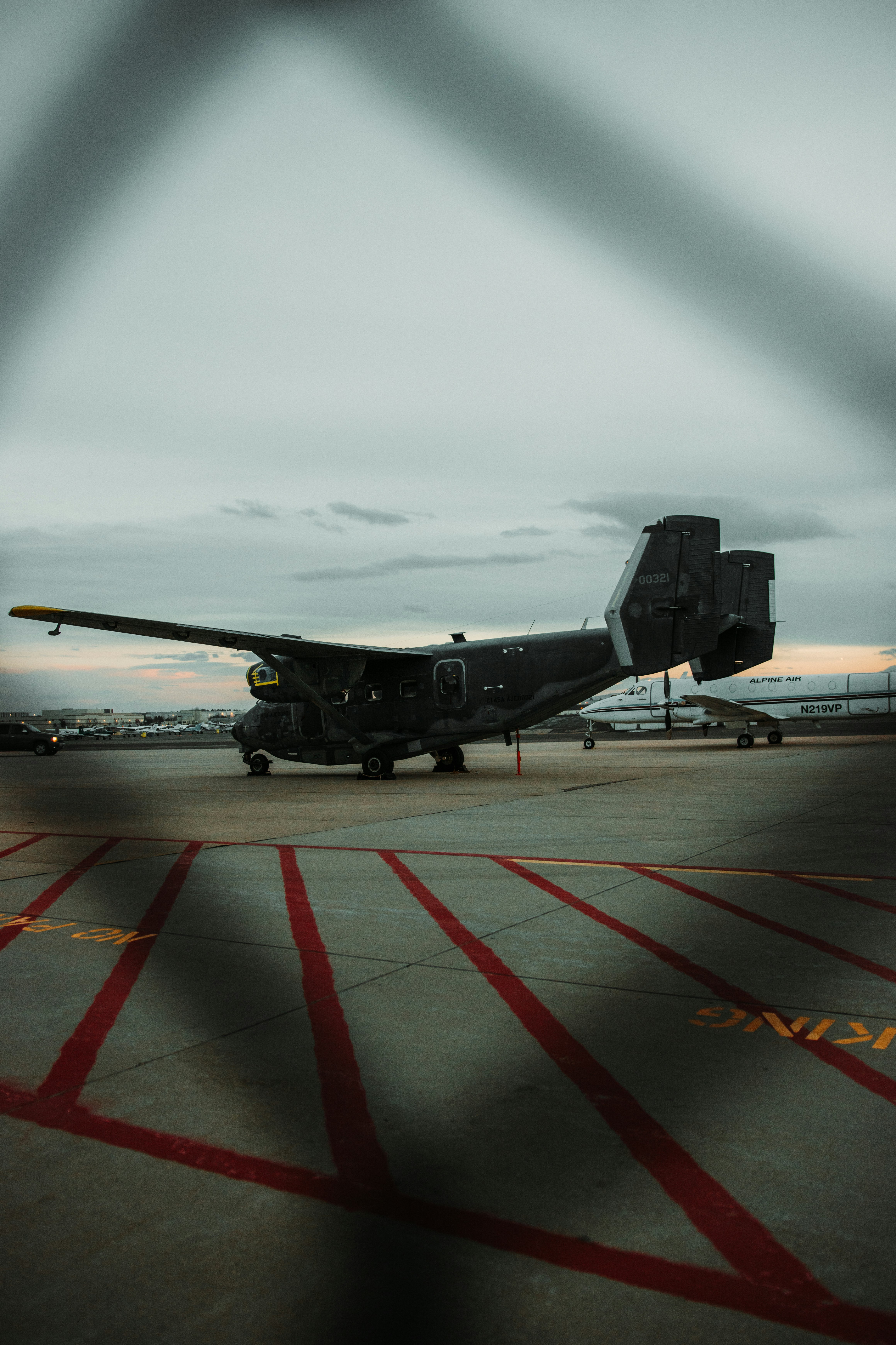 black jet plane on airport during daytime