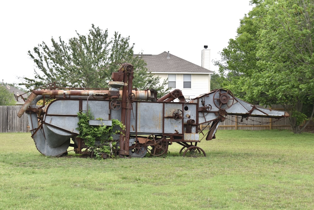 brown and white wooden shed on green grass field during daytime