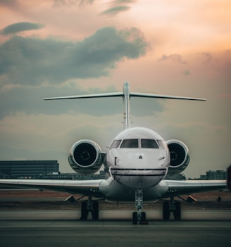 white airplane on airport during daytime