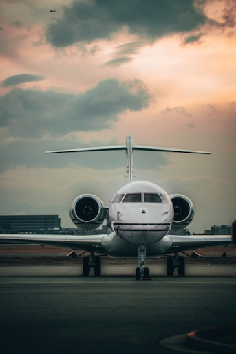 white airplane on airport during daytime