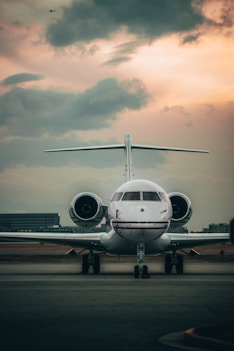 white airplane on airport during daytime