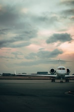 white airplane on airport during daytime