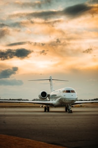 white airplane on airport during daytime