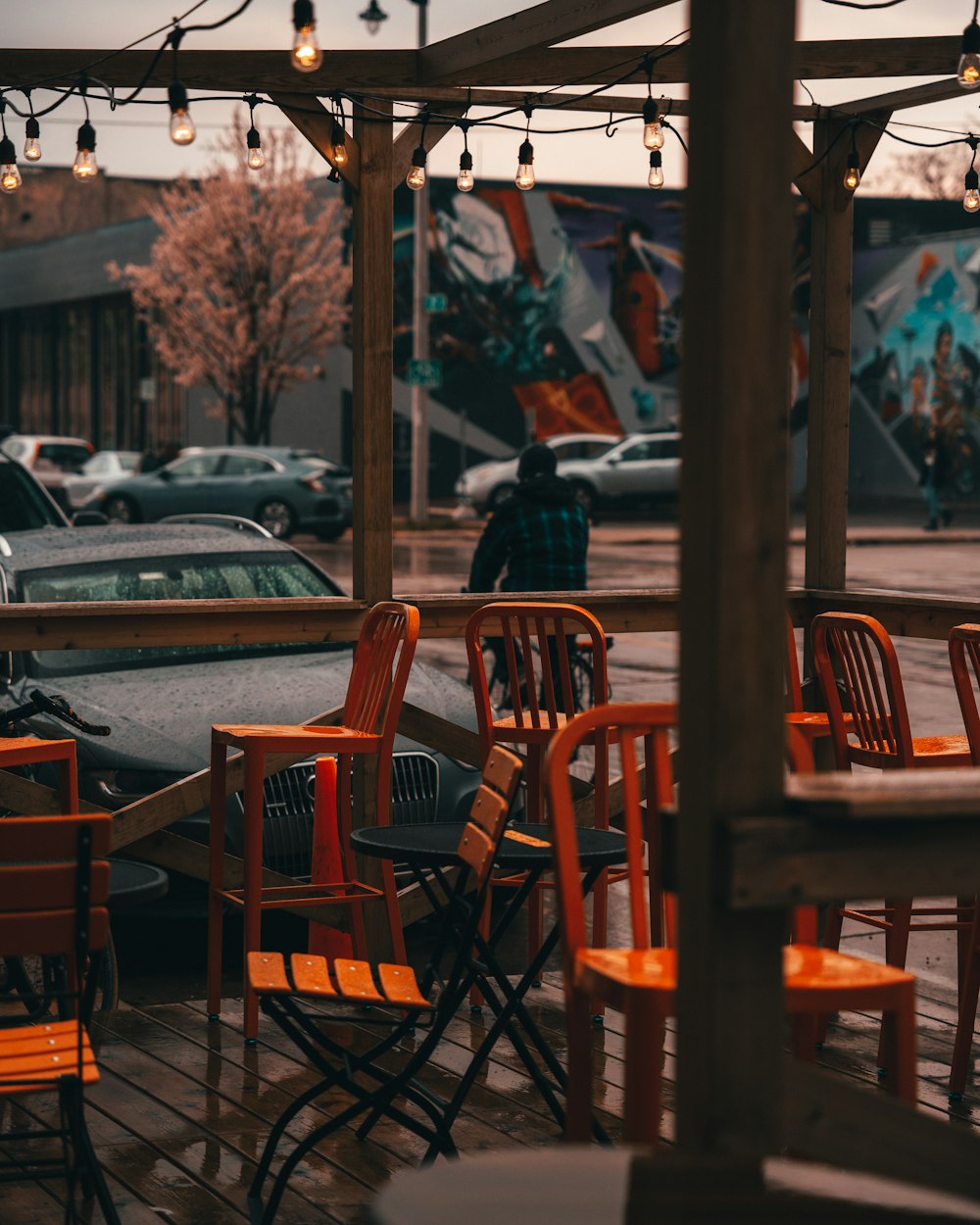 people sitting on brown wooden chairs during daytime