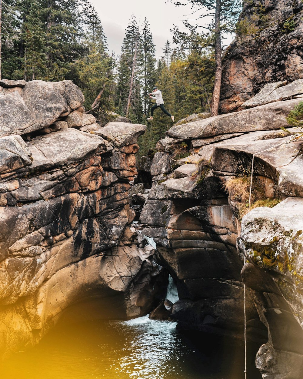 brown rocky mountain near river during daytime