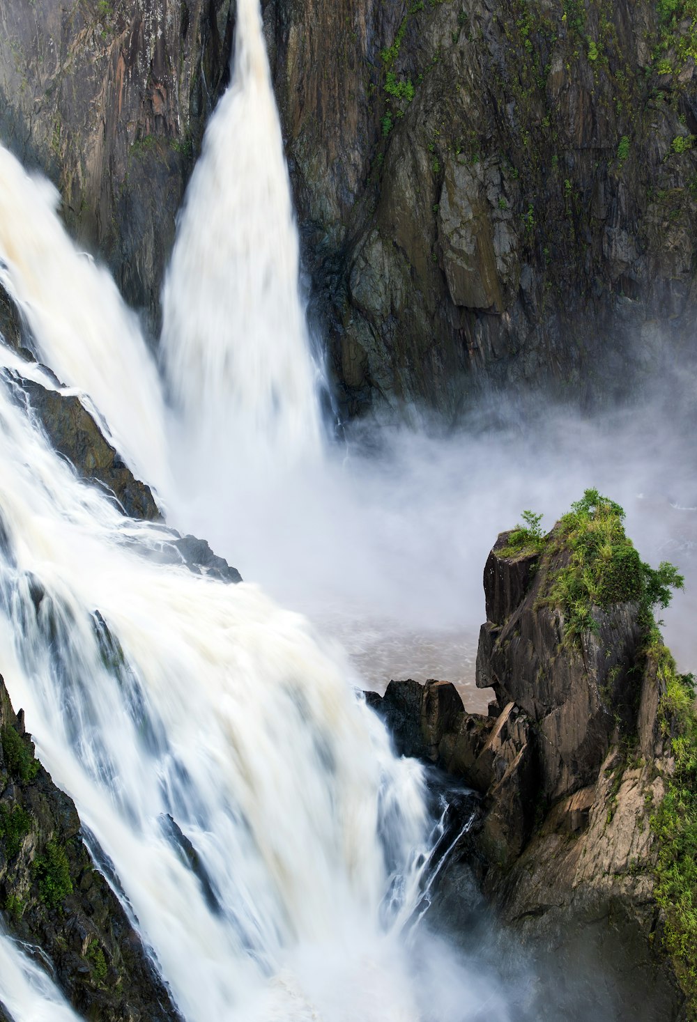 waterfalls on rocky mountain during daytime