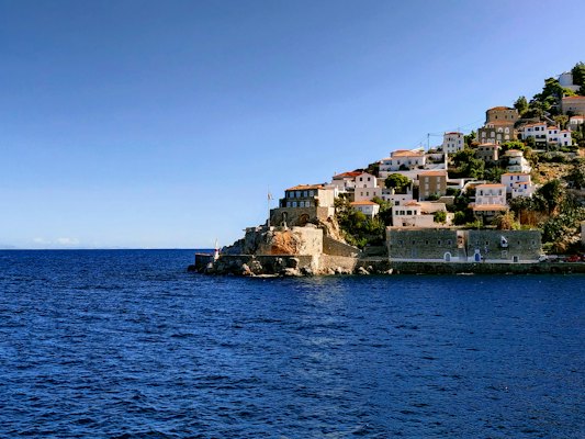 City buildings near body of water during daytime — Hydra, Greece