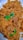 A plate filled with golden-brown rice mixed with chunks of tender meat, garnished with fresh green coriander leaves.
