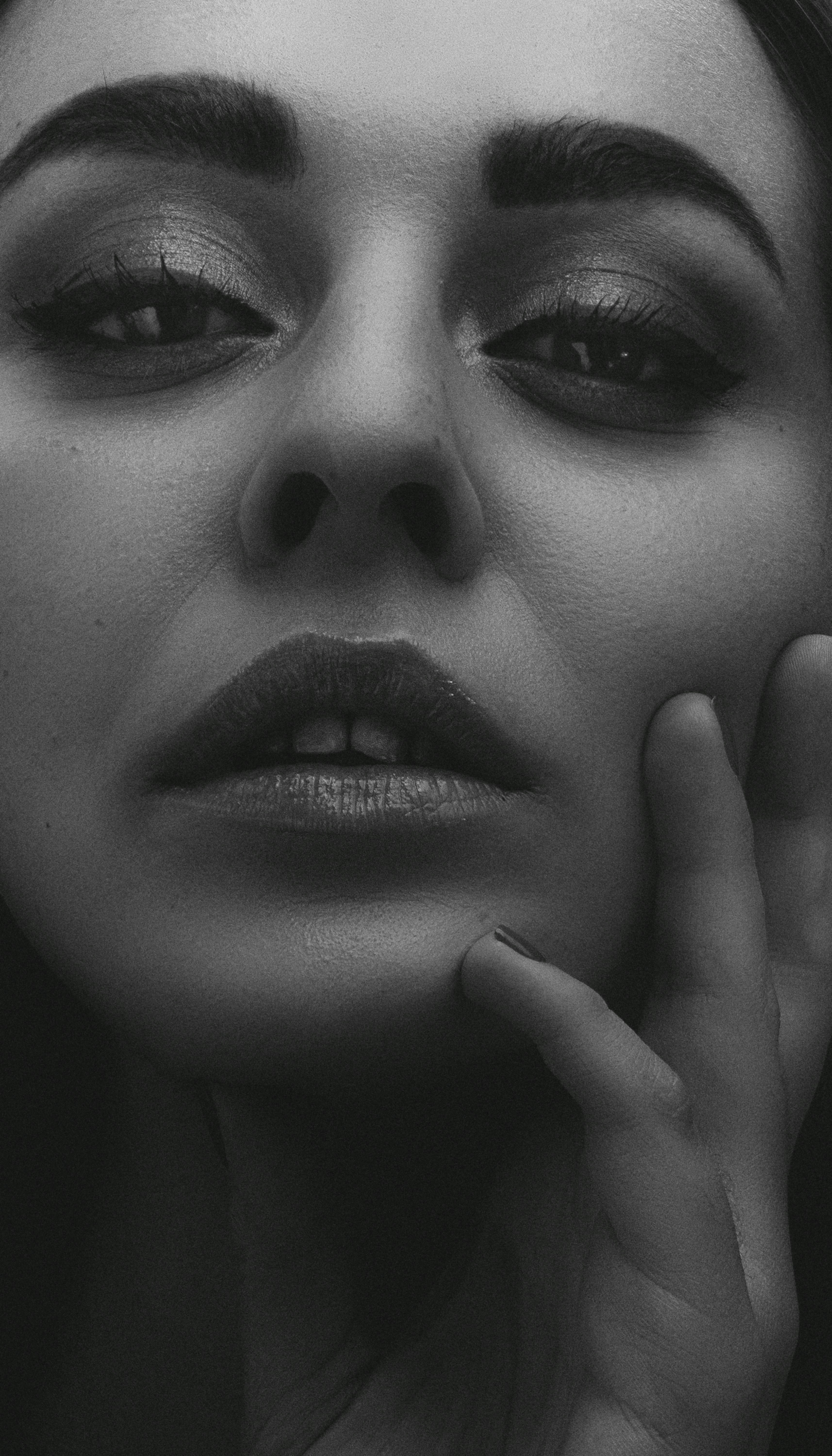 grayscale photo of womans face
