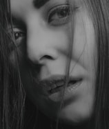 grayscale photo of womans face