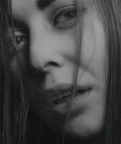 grayscale photo of womans face