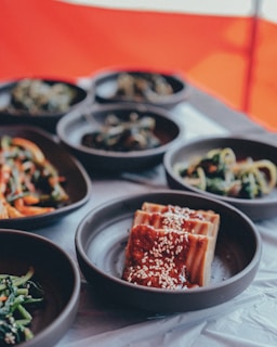 An elegant display of international vegan cuisine in bowls.