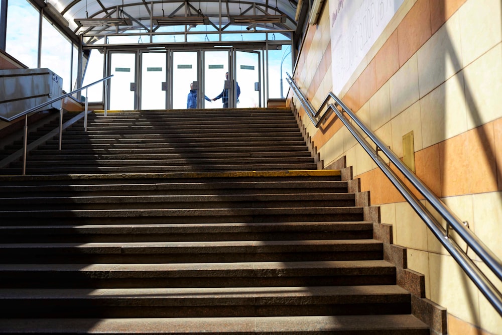 people walking on stairs inside building