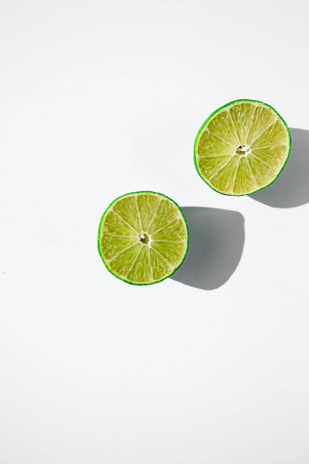 sliced lemon on white surface