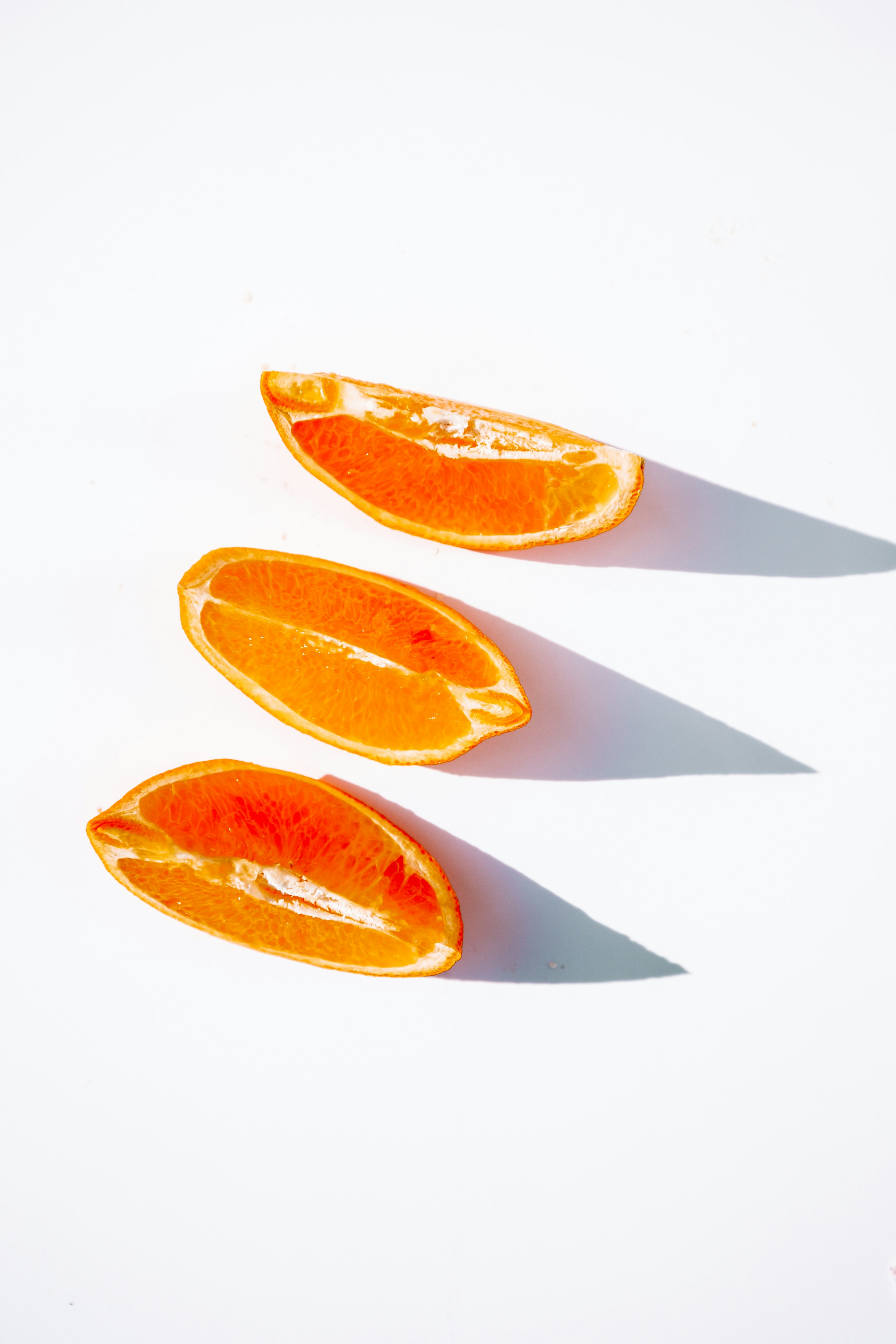 sliced orange fruit on white plate