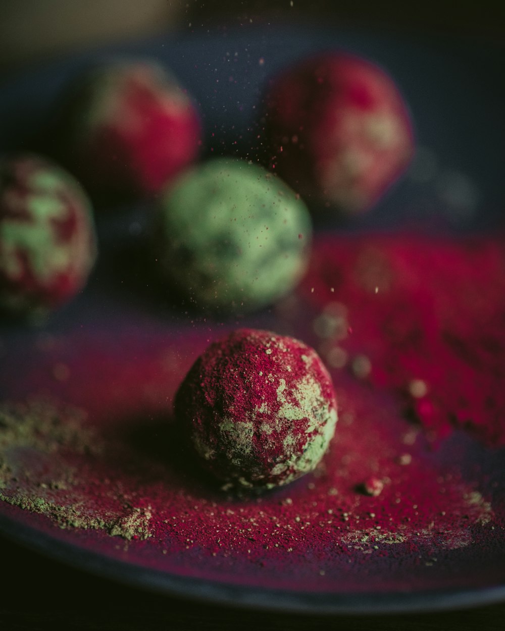 green and red round fruits