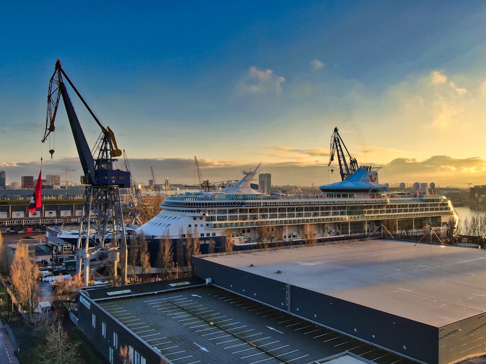 white and blue ship on dock during daytime