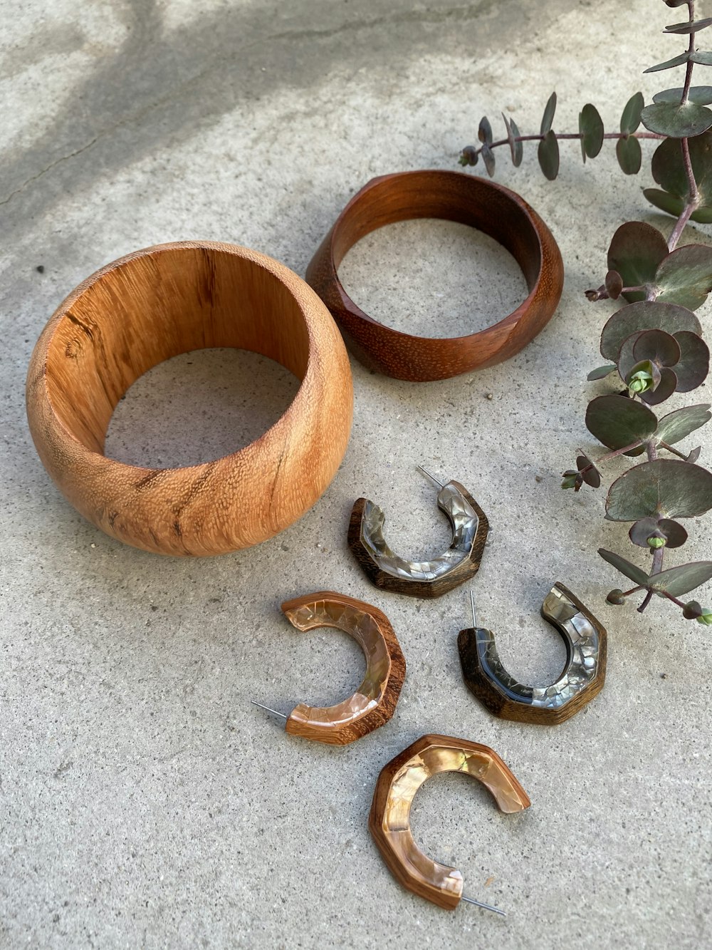 brown wooden round ornament on gray concrete floor