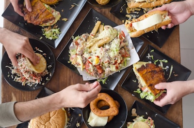 An inviting table setting featuring a selection of sandwiches and burgers.