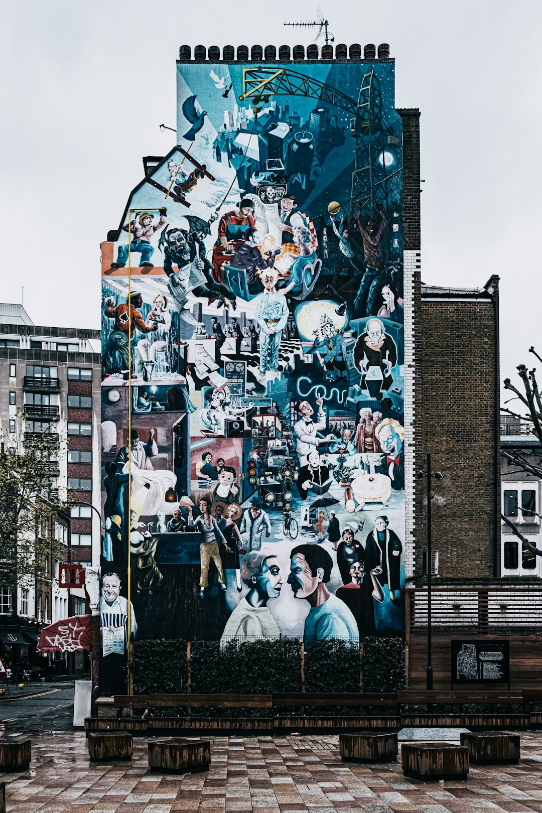 people standing near wall with graffiti