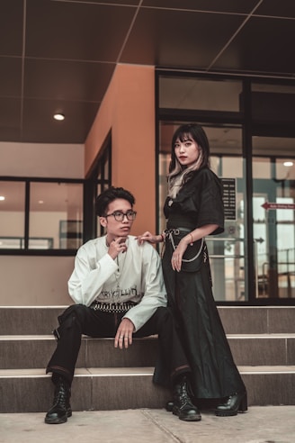 man and woman sitting on stairs