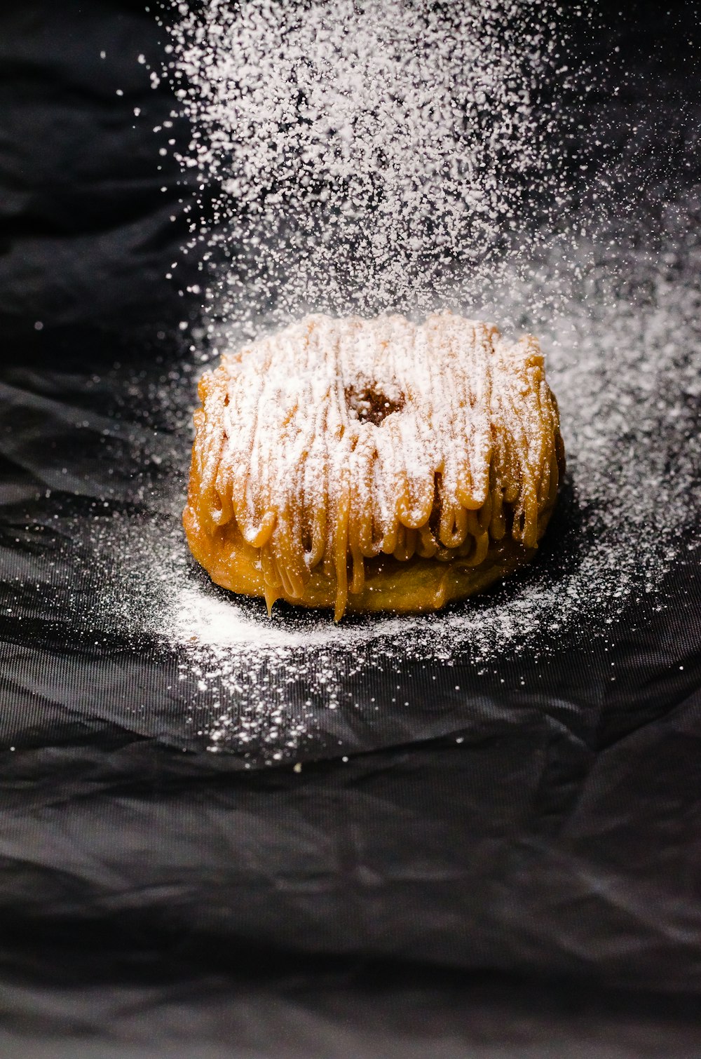 brown pastry on black textile