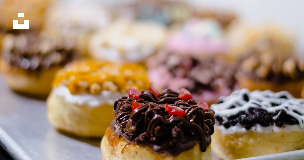 Brown and white pastry with black and red berries on top photo – Free ...