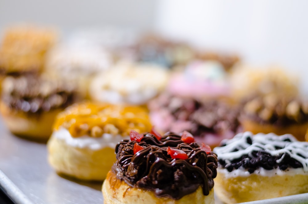 brown and white pastry with black and red berries on top