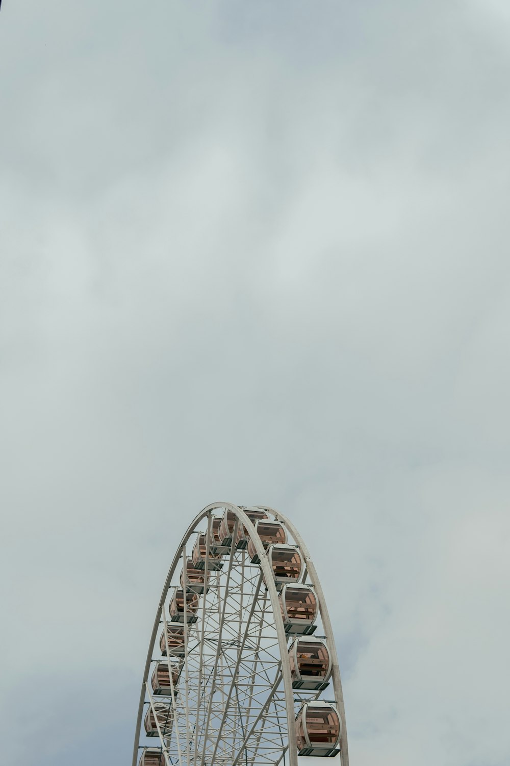 white ferris wheel under white sky