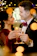 A smiling couple raising glasses at their elegant wedding reception with a Bartenders VIP Mix bar in the background.