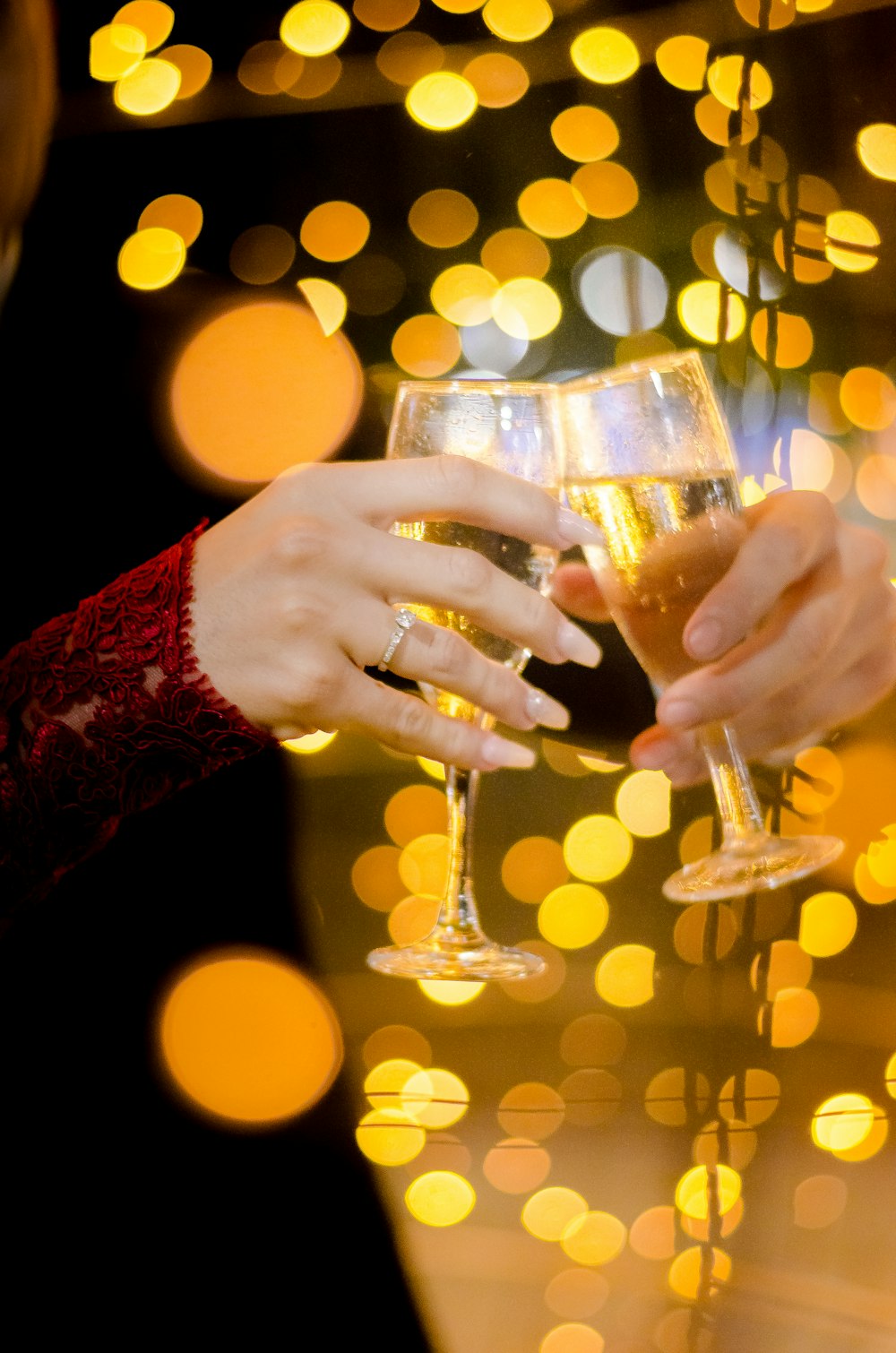 person holding clear wine glass