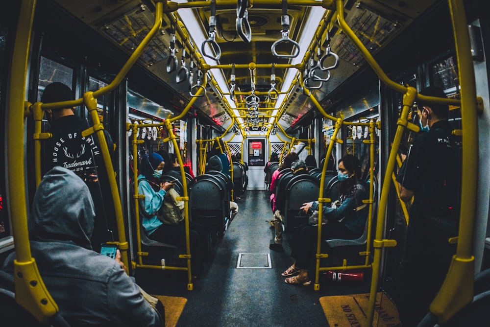 people sitting inside train during daytime