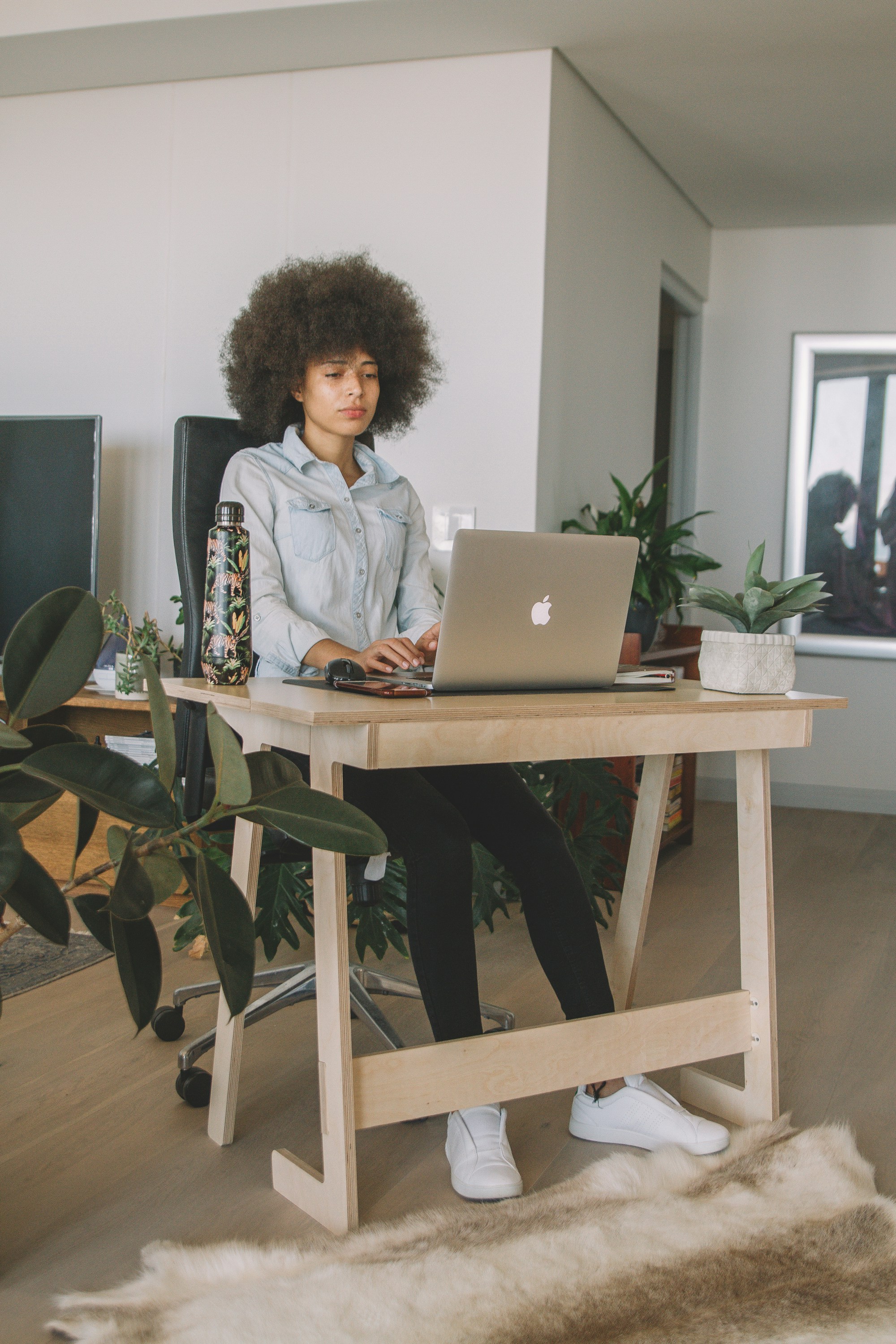 woman-in-gray-jacket-sitting-on-chair-using-macbook-photo-free-grey