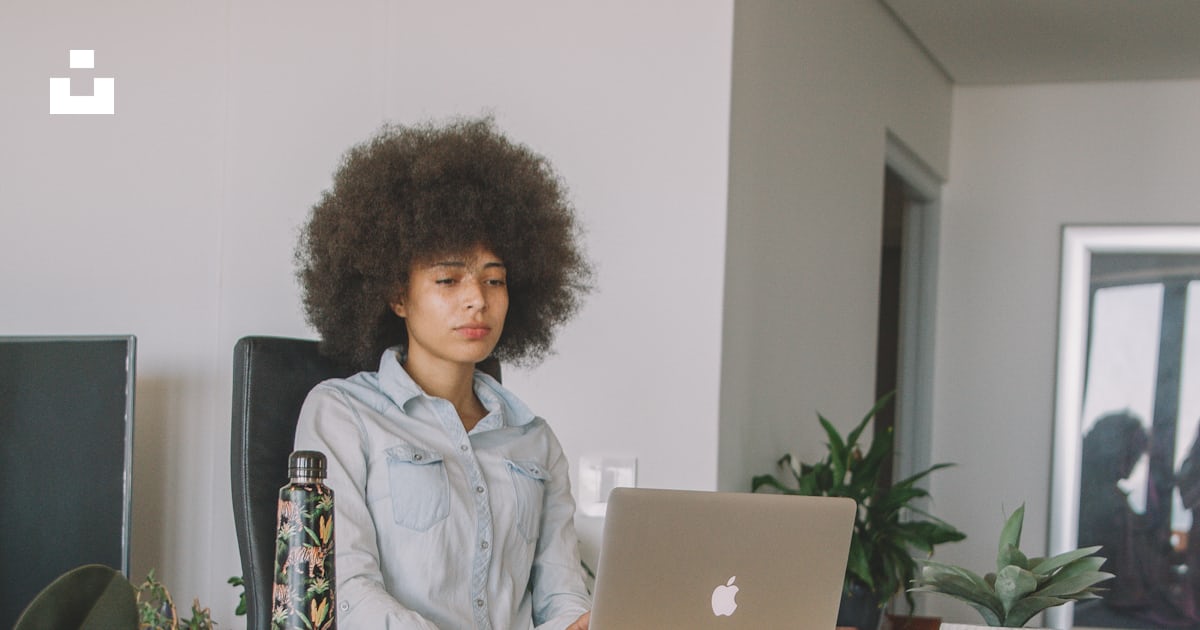 Woman In Gray Jacket Sitting On Chair Using Macbook Photo Free Grey woman-in-gray-jacket-sitting-on-chair-using-macbook-photo-free-grey