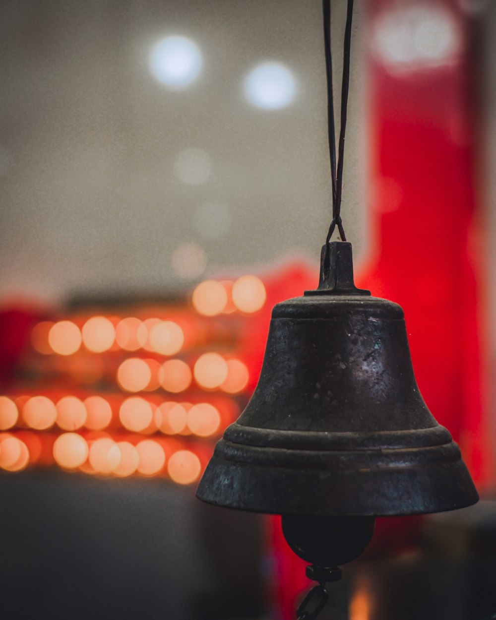 black bell with bokeh lights