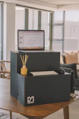 Casual home office setup highlighting a functional yet stylish laptop stand.