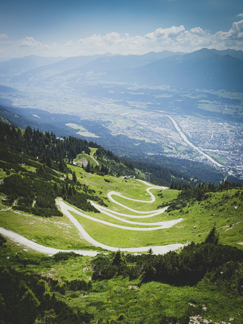 green trees on mountain under blue sky during daytime