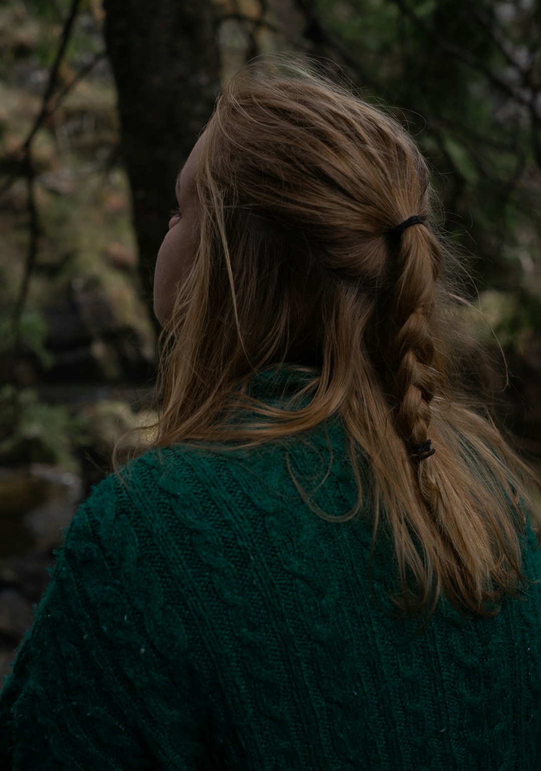 woman in green knit shirt