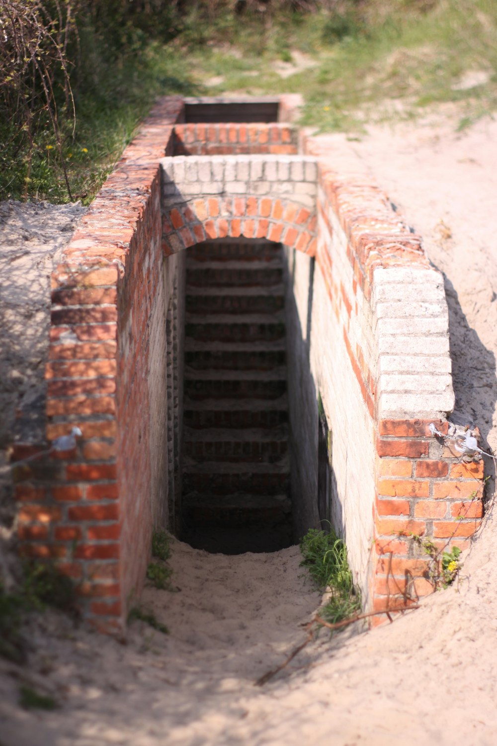 brown brick tunnel during daytime