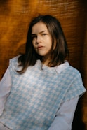 woman in white and blue polka dot shirt